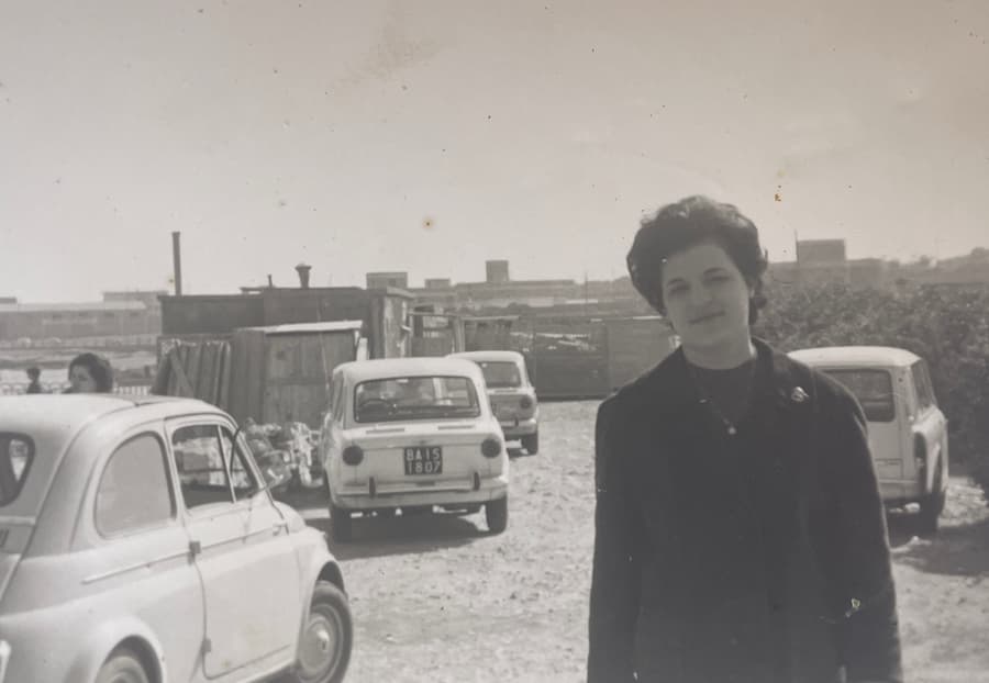 The same faded photograph fully restored — contrast, tones, and fine detail recovered